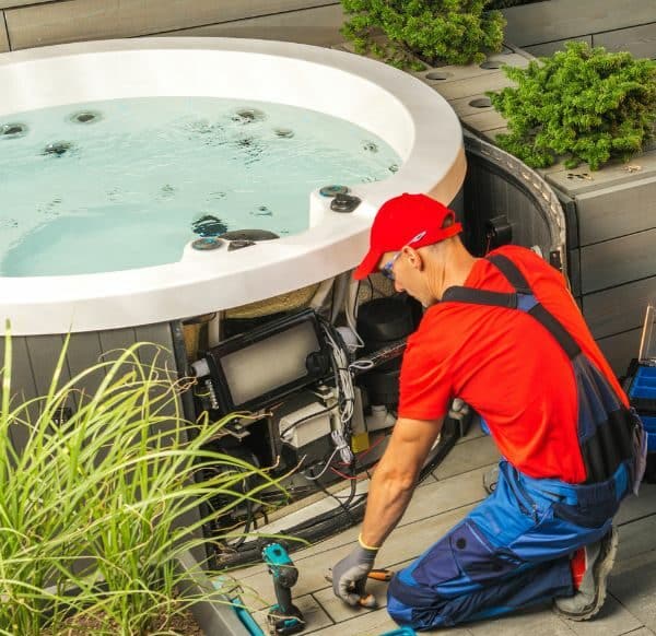 Person Installing Agua Lounde Spas Hot Tub